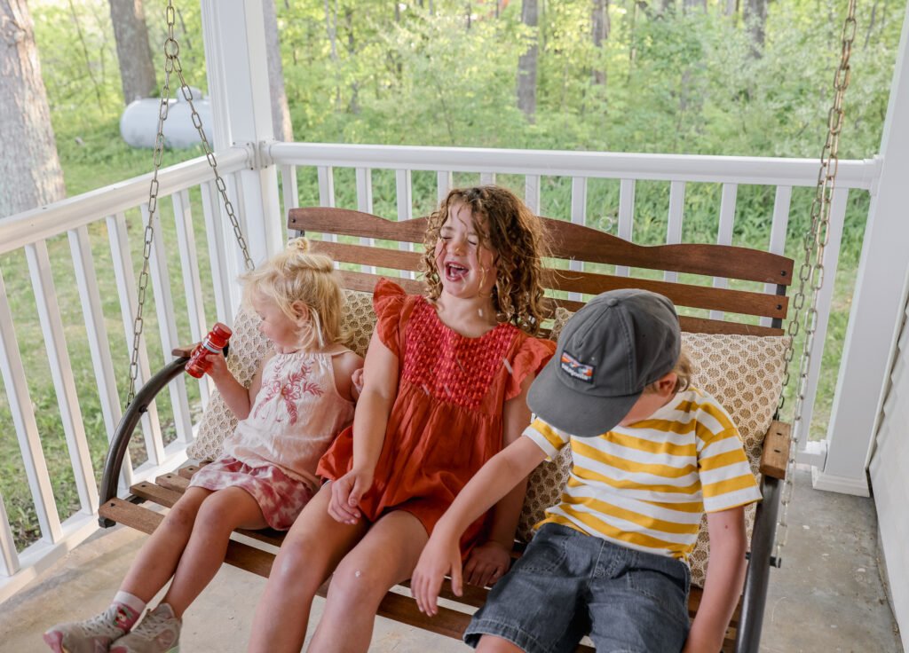 Kids on porch swing
